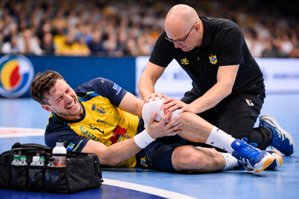 knäskadad handbollsspelare
